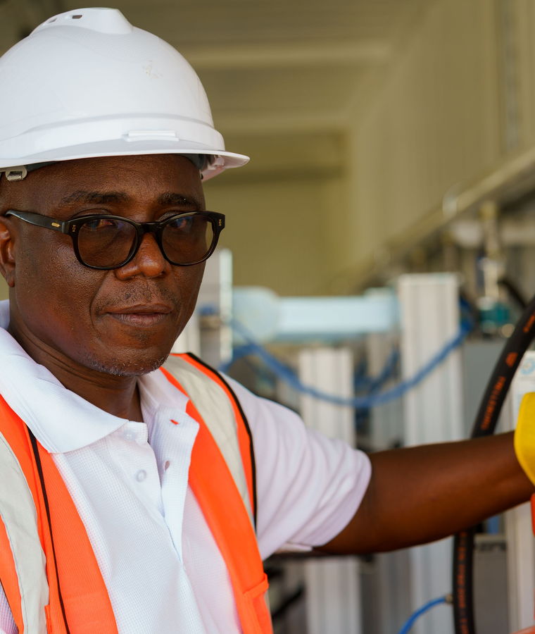 A Karam Gas plant operator at the cylinder filling station